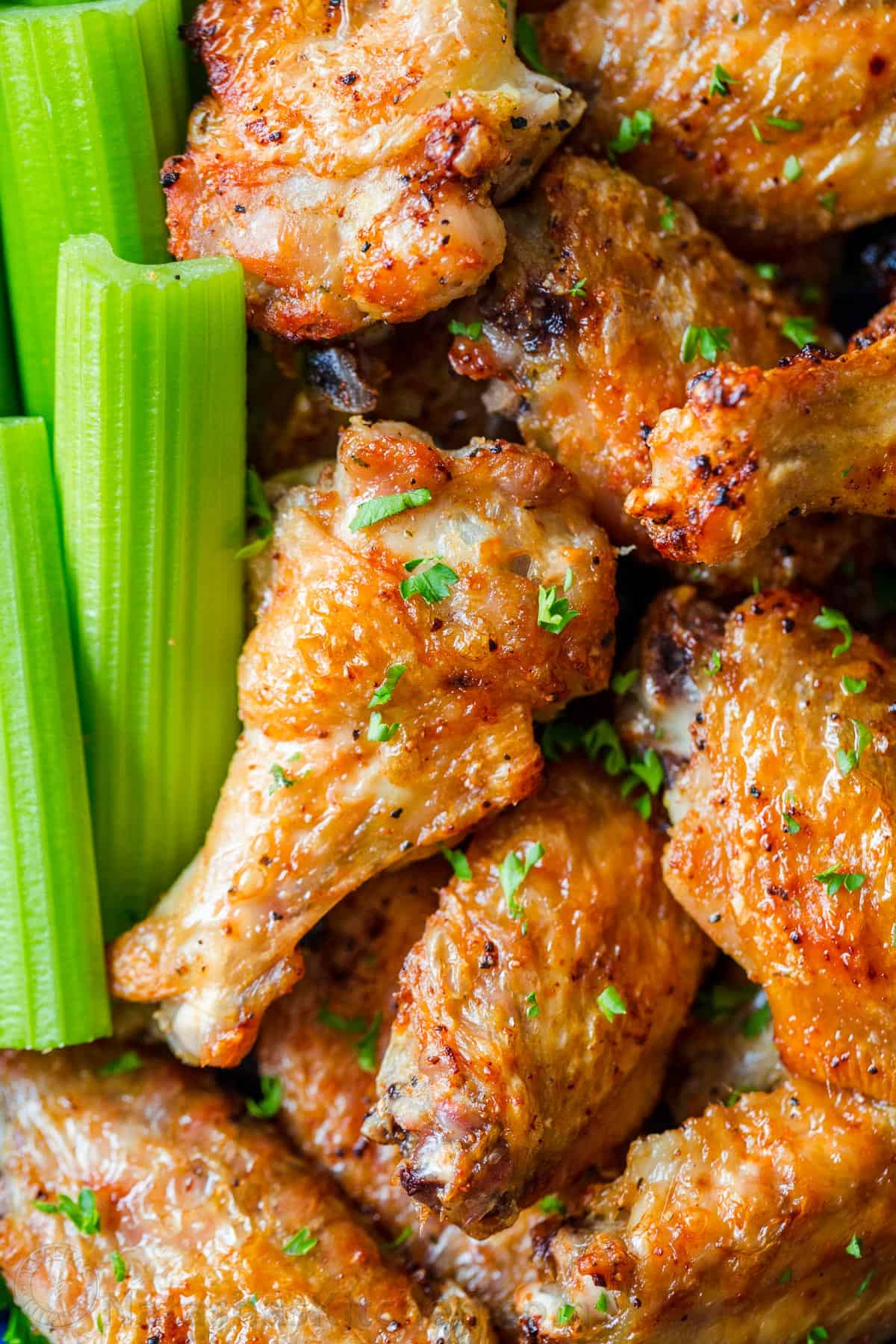 Crispy air fried chicken wings with celery sticks