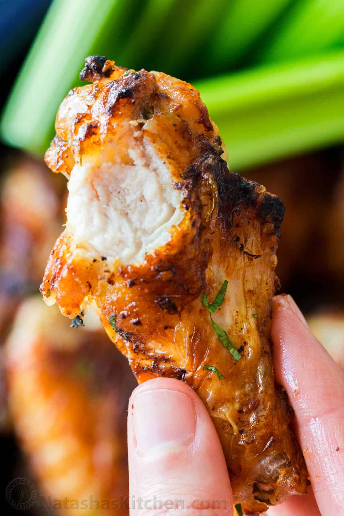 Bitten into Air Fryer chicken wing up close 