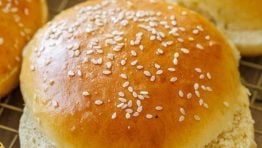 Cut homemade hamburger buns with sesame seeds