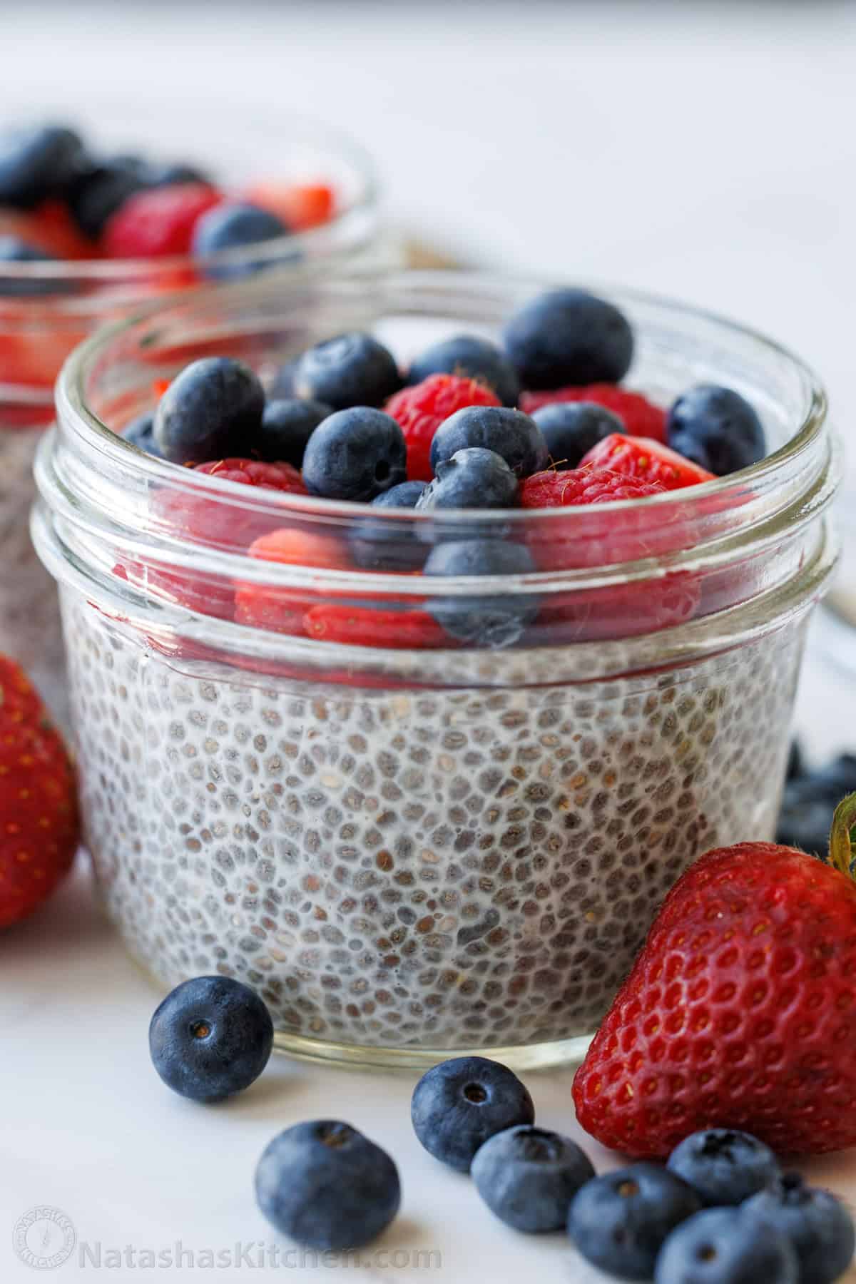 overnight chia pudding in a mason jar with fruit on top