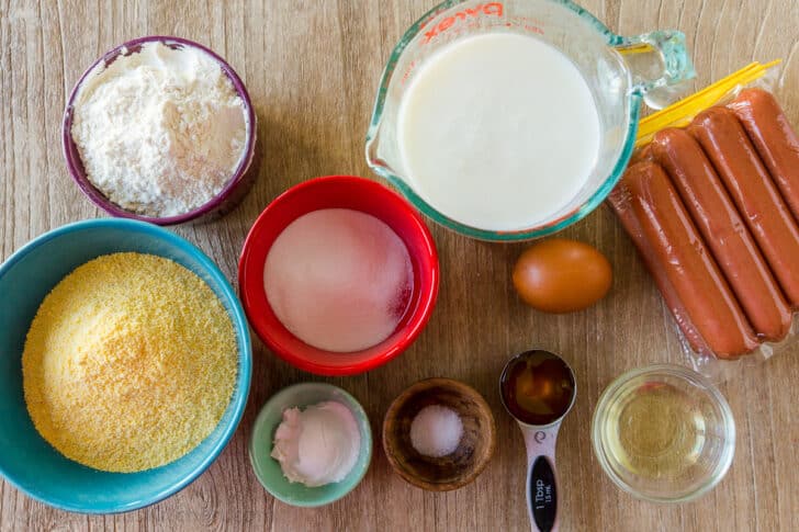 ingredients for corn dogs with corn meal, hot dogs and batter ingredients