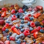 Croissant french toast casserole dusted with powdered sugar