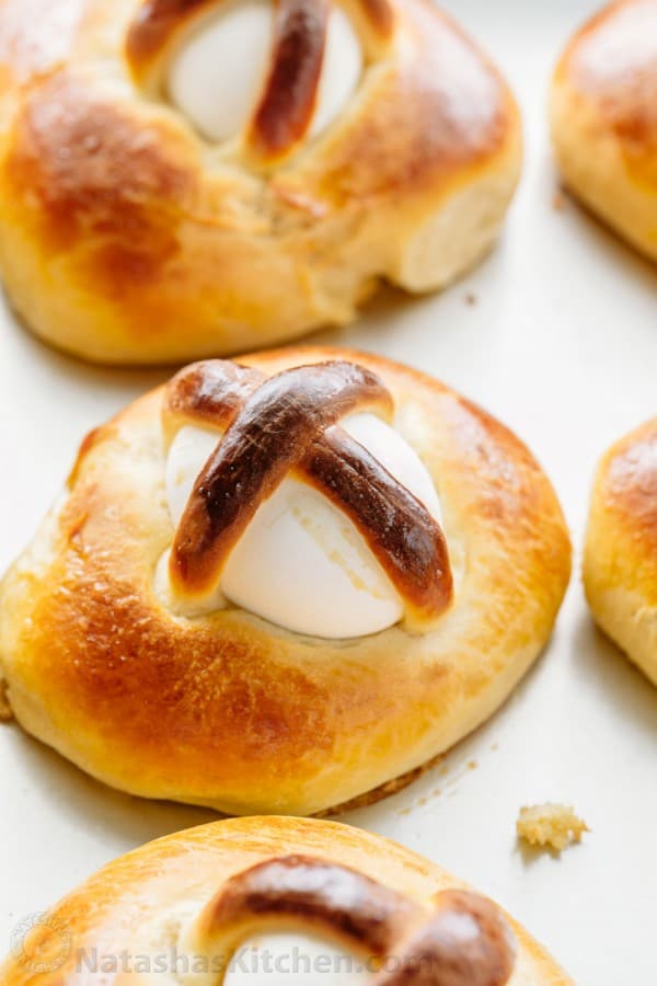 This Easter Breads recipe produces a billowy soft, golden and lightly sweet Easter bun with a perfectly cooked egg. Beautiful way to share the Easter story! 