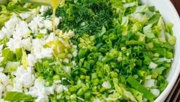 How to drizzle maroulosalata dressing over greens