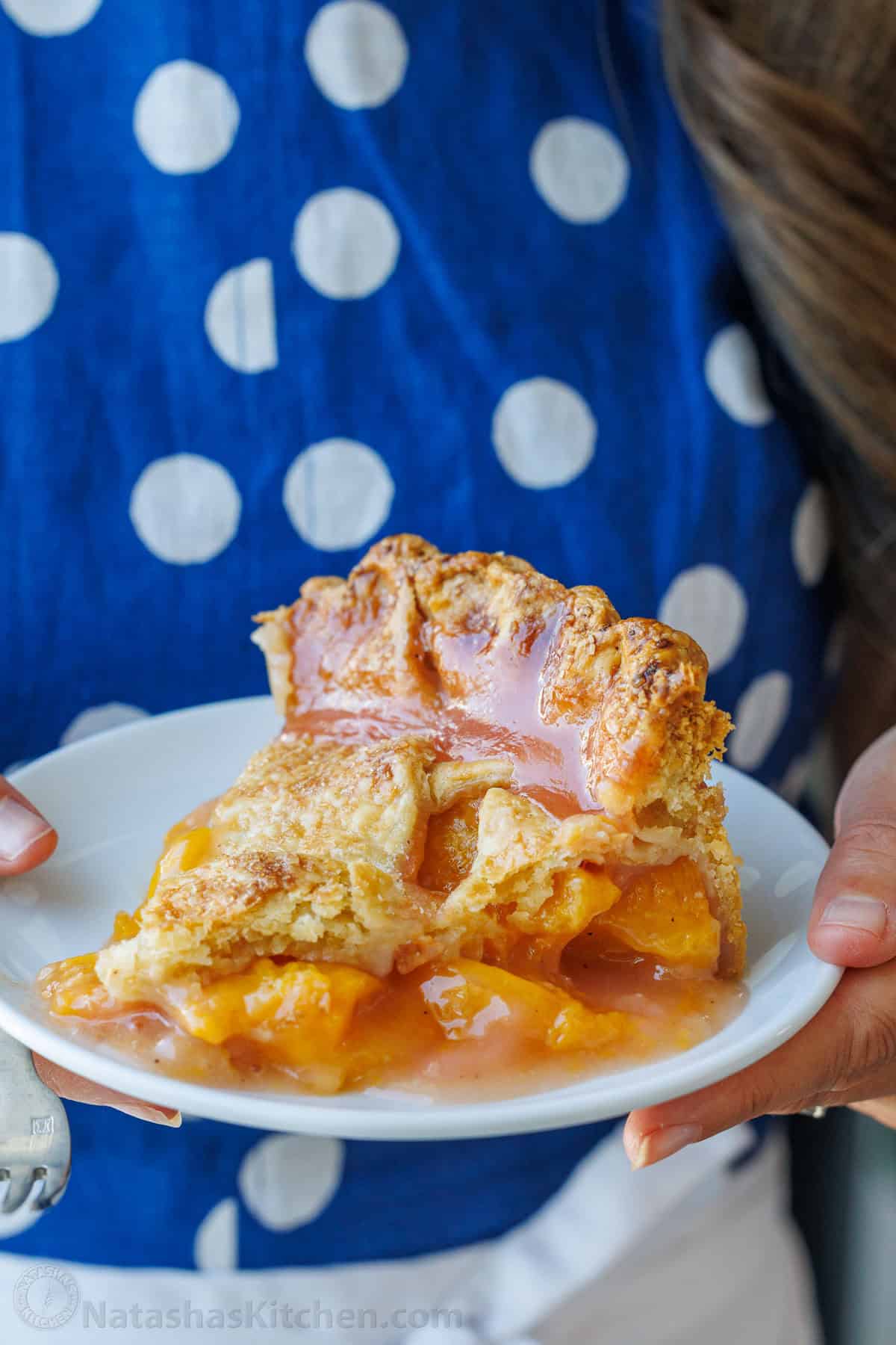 Plate of fruit dessert carried by a woman