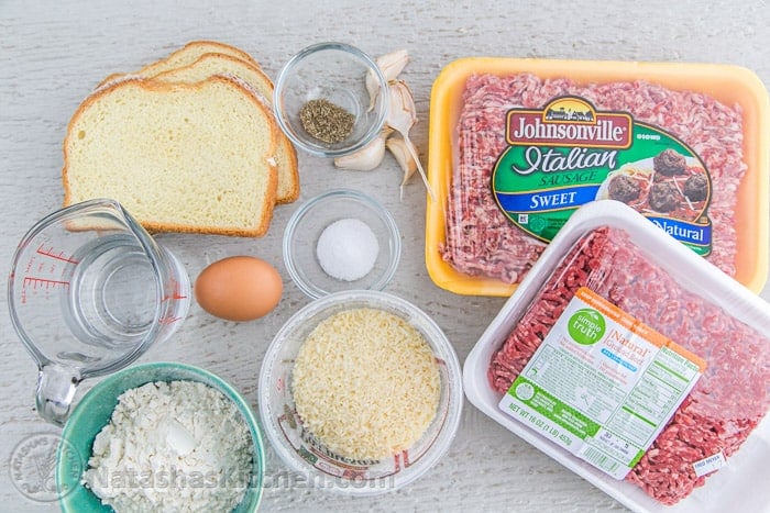 Ingredents for making classic Italian pasta dish including Italian sausage, ground beef, white bread, salt, pepper, garlic, egg, water, flour and parmesan cheese