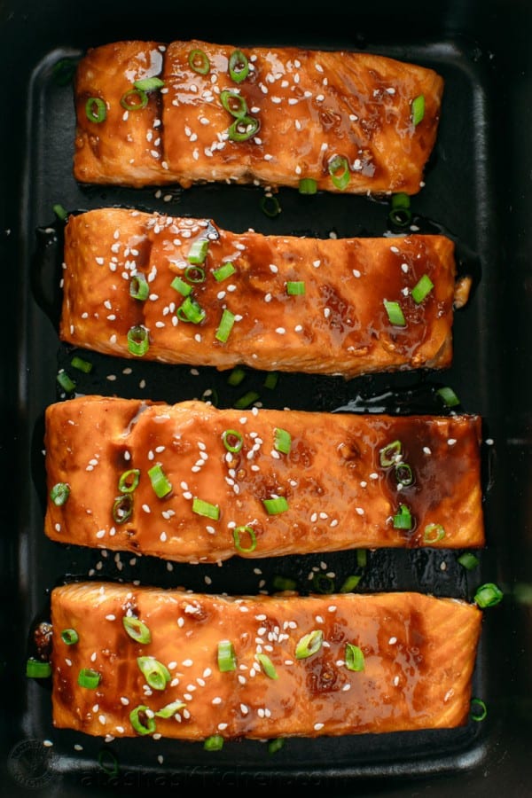 Teriyaki glazed salmon arranged in serving platter with serving suggestion for teriyaki salmon